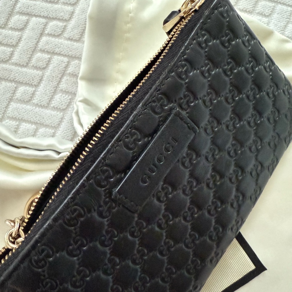 Authentic Gucci coin key wallet pouch. Black leather. Made in Italy